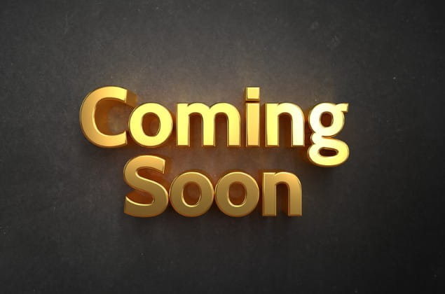 Coming Soon Words "Coming Soon" lit up in gold letters on a brown background.