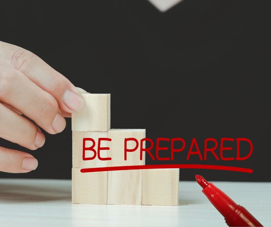 Be Prepared Hands stacking blocks with words "Be Prepared" written in red.