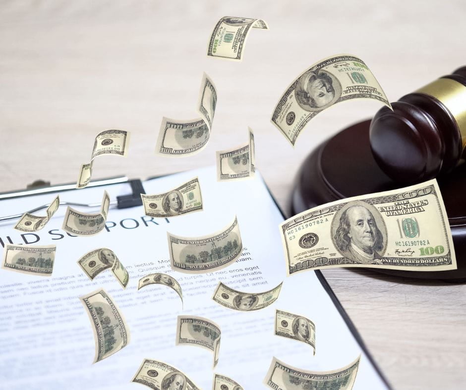 Child support agreement next to gavel with dollar signs floating on top.