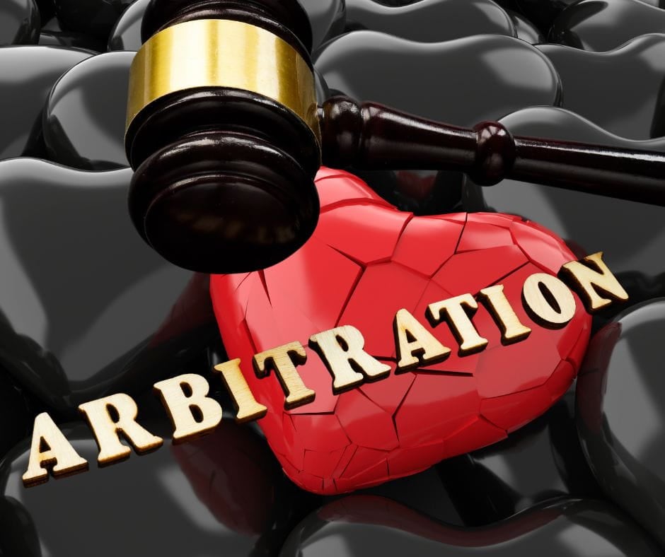 Divorce Arbitration Gavel and broken heart with the word "arbitration" on them. Divorce arbitration.