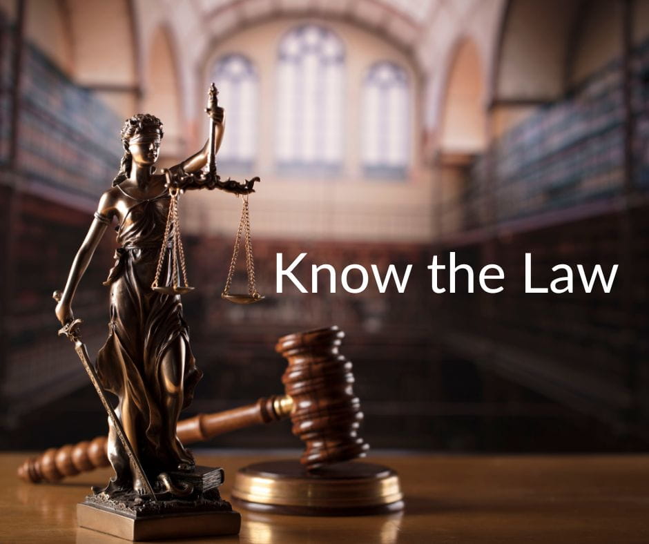 Scales of justice in a law library with caption: Know the law.
