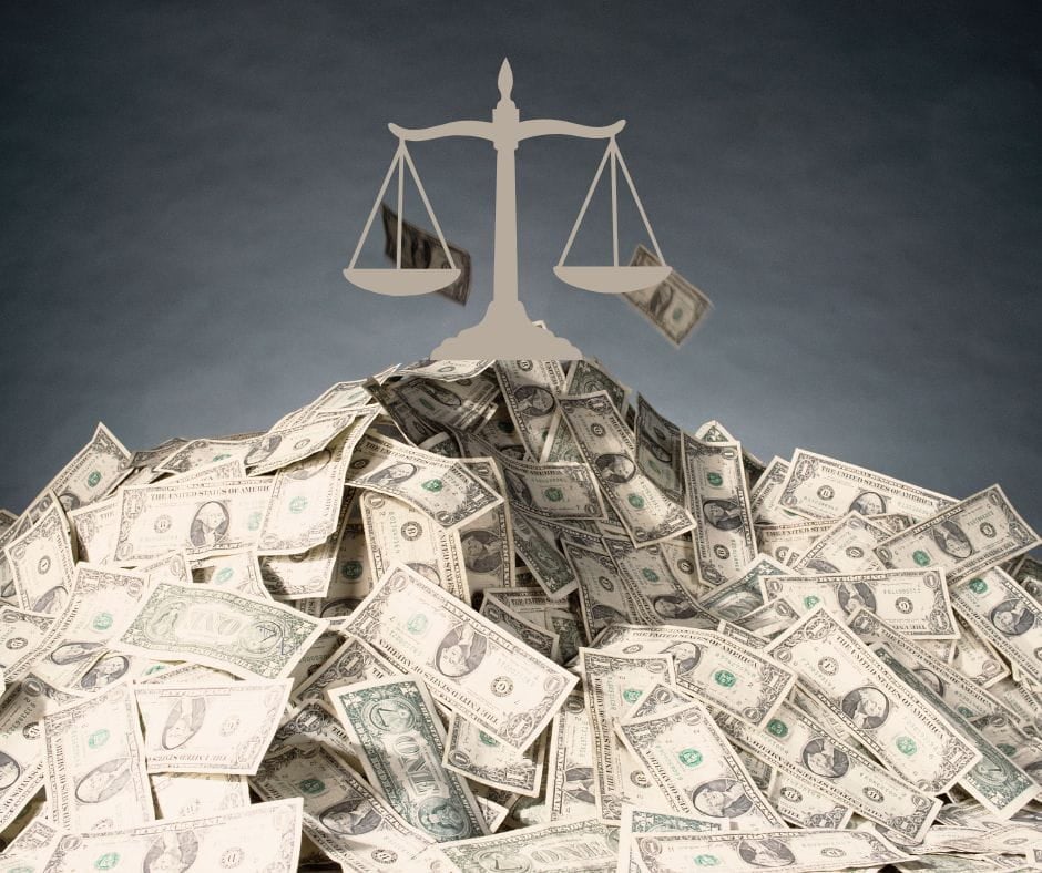 Mediating Money Issues Pile of money with scales of justice on top.