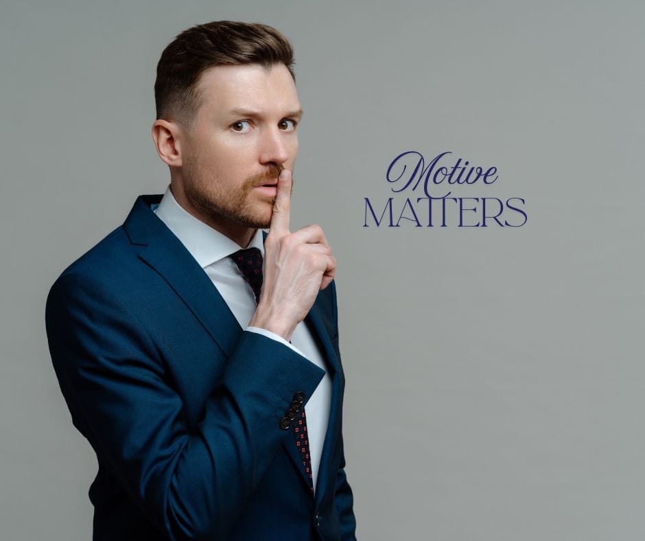 Motive Matters Secretive businessman with finger to his lips. Motive Matters