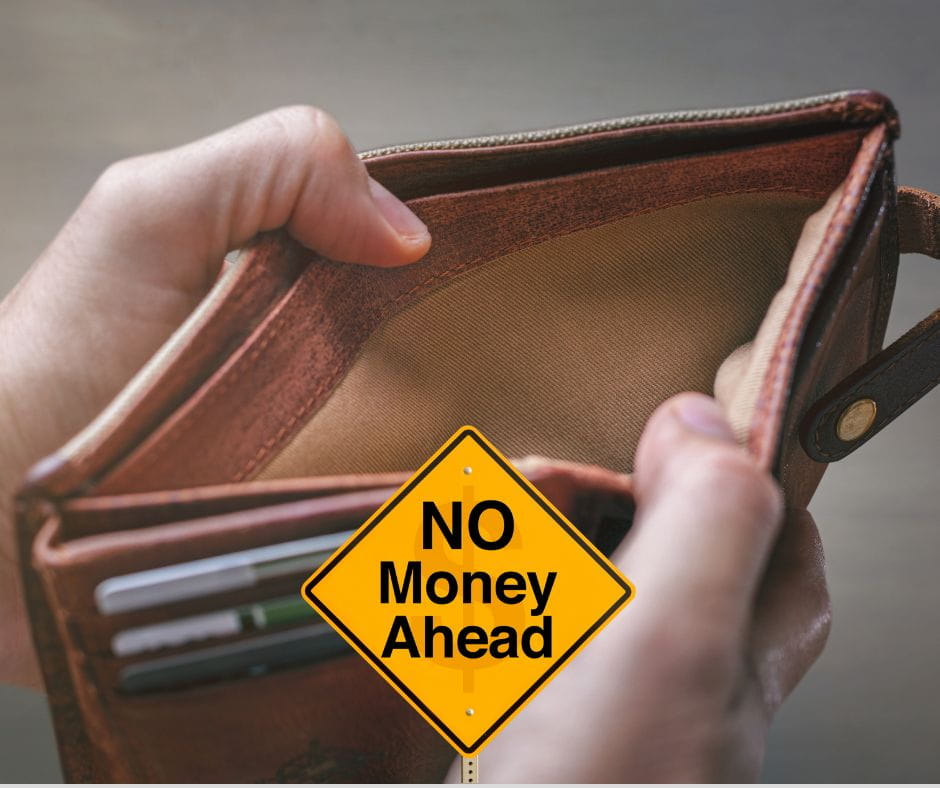 No Money Empty wallet with yellow traffic sign saying "No Money Ahead."