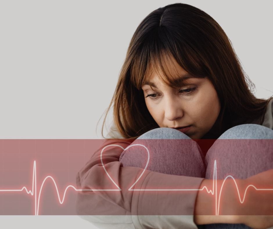 Sad woman who's husband is having an emotional affair. A heartbeat tape is superimposed over the top.
