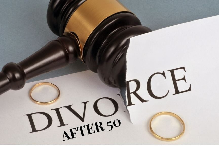 a judge's gavel causing a tear to appear on a piece of paper with the words "divorce after 50" on the paper. Each torn side of the paper has a wedding ring.