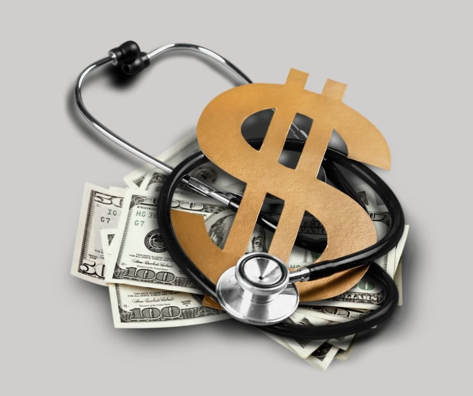 Stethoscope and dollars with dollar sign. Divorce and health insurance.
