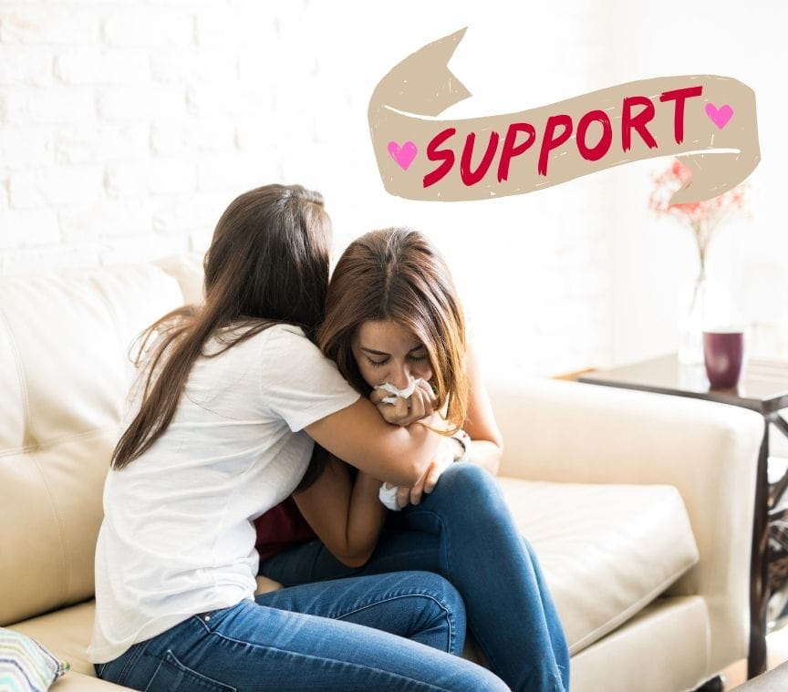 Woman hugging her friend in support during a difficult time
