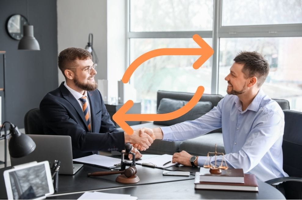Two lawyers shaking hands, the switching sign between them
