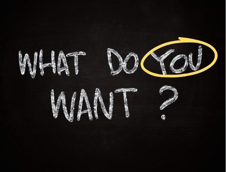 the words "what do YOU want?" written in chalk