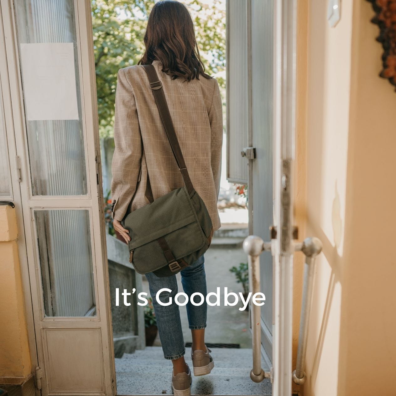 Goodbye Woman leaving her house with the words "It's Goodbye" on the picutre.