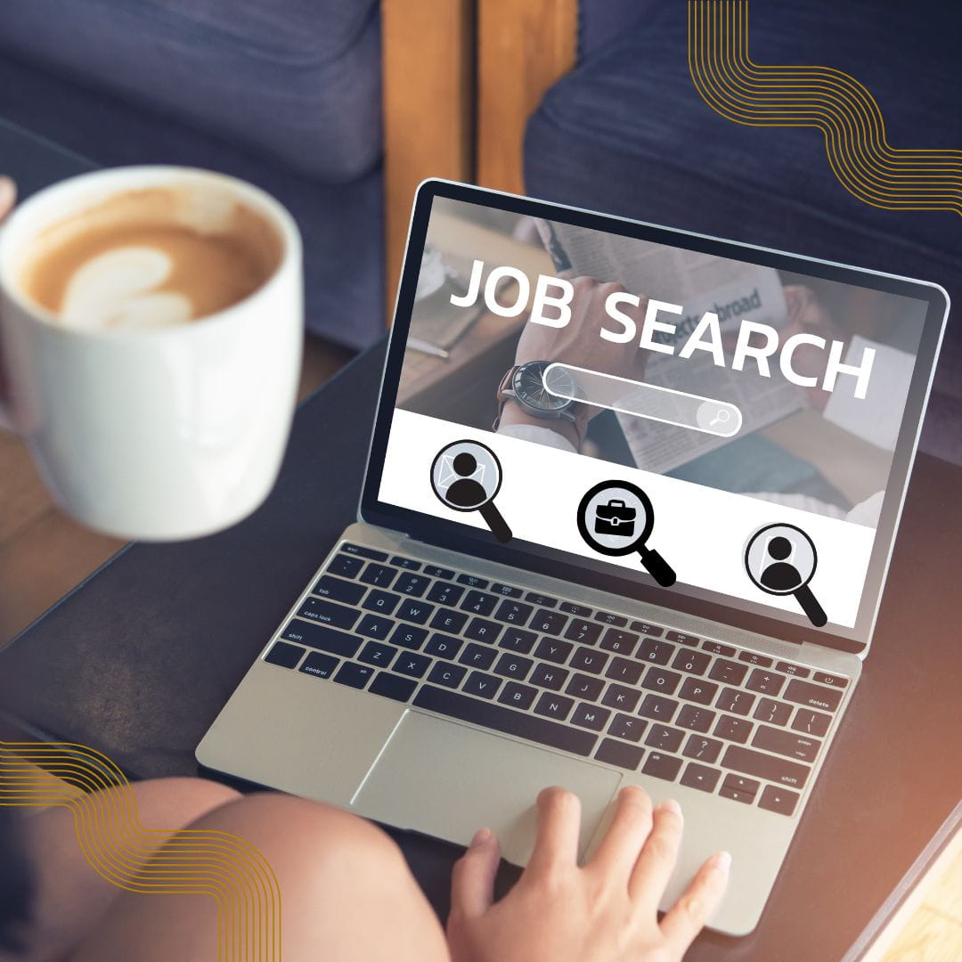 Job Search Open laptop with the words "Job Search" and a woman looking at it in a coffee shop.