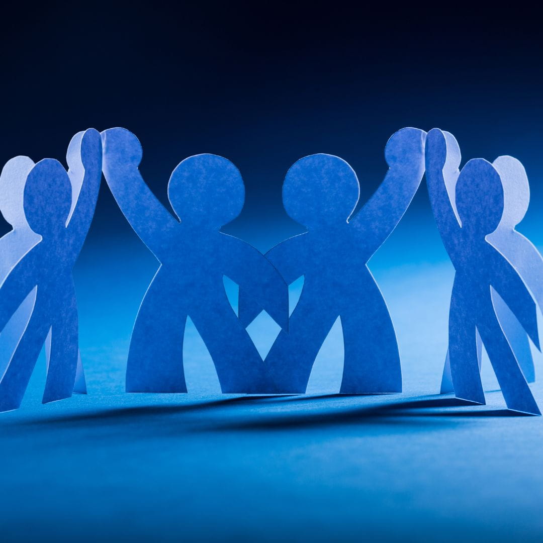 4 blue figures high-fiving each other. Team.